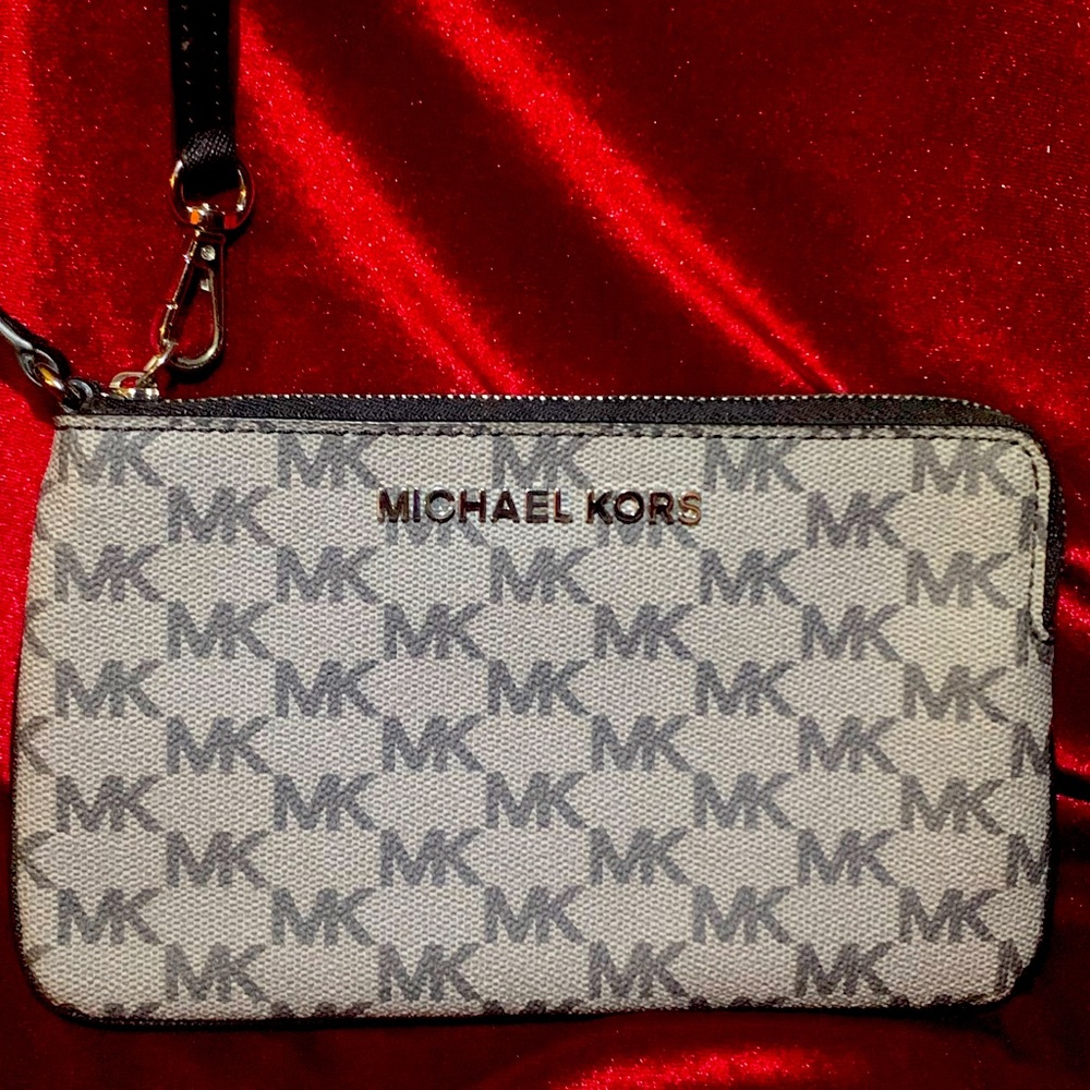 Michael Kors leather black and gray MK pattern wristlet.